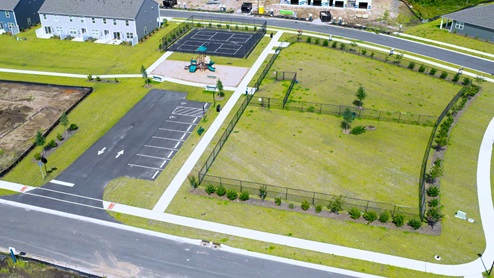Residents have access to a range of amenities such as a well-equipped clubhouse, a fitness room, a spacious competition swimming pool, a kiddie pool, a hot tub, a sports court, a playground, and picturesque nature trails for walking.