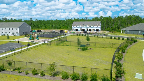 Residents have access to a range of amenities such as a well-equipped clubhouse, a fitness room, a spacious competition swimming pool, a kiddie pool, a hot tub, a sports court, a playground, and picturesque nature trails for walking.