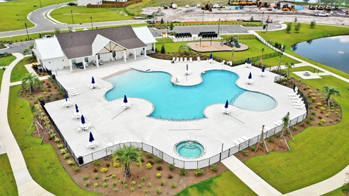 Homeowners will enjoy a resort style swimming pool, clubhouse with full kitchen, fitness room, simulated golf, pool table, fire pit area, multi-game court, discovery playground and amenity pond.