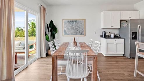 The kitchen features beautiful cabinets, granite countertops, and stainless steel appliances, which are sure to both turn heads and make meal prep easy. You’ll never be too far from the action with the living and dining area right there.