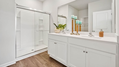 The primary bedroom has its own attached bathroom that features a walk-in closet and all the space you need to get ready in the morning. Sharing a sink isn’t a worry with the double vanity, and you also get additional privacy with a separate door for the toilet and shower.