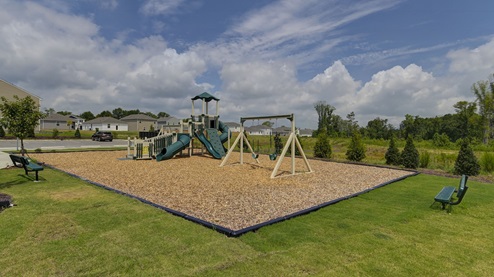 There is a slide, swing set, etc. on the playground