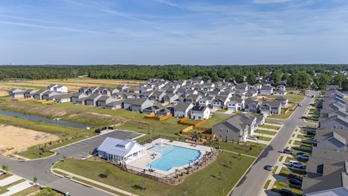 Drone photo showing the proximity of homes to the pool.