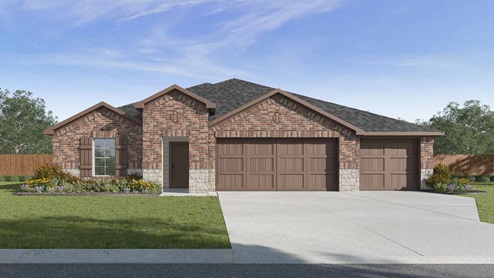 Single story brick home with a three car garage