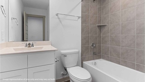 Secondary bathroom with sink and bathtub and shower combo