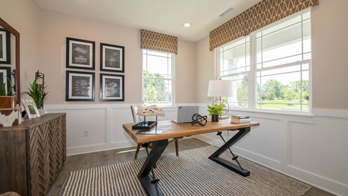 Henley den with white wainscoting