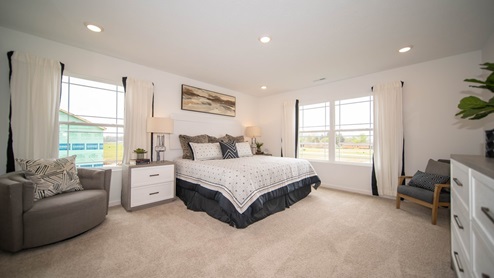 primary bedroom with large windows