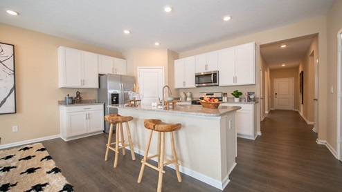 kitchen with white cabinets and island