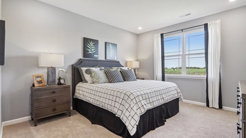 primary bedroom with large windows