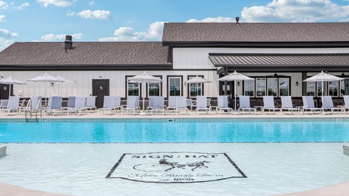 Miles Farm family logo in bottom of pool