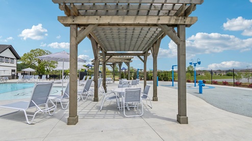 shaded pergola seating at Miles Farm pool