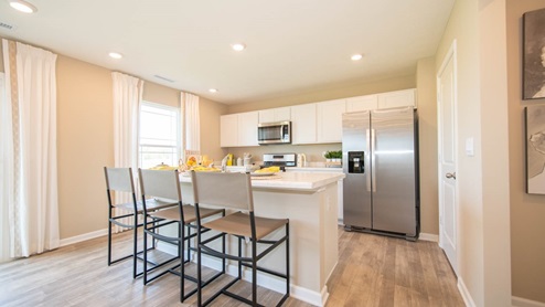 kitchen with white cabinets and island
