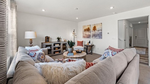 Colonial Heights Bellamy model home - living room with carpet flooring