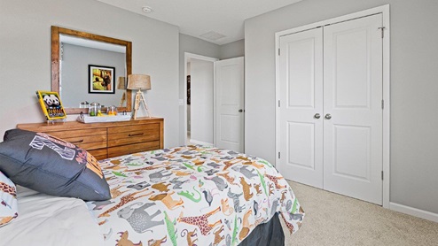 Parlor Bluffs Henley Model Bedroom 1 with carpet flooring