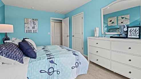 Parlor Bluffs Henley Model Bedroom 3 with bright blue walls as a childrens bedroom