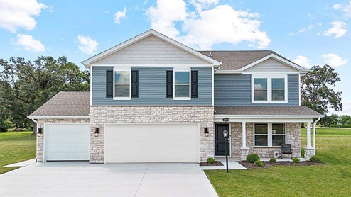 Parlor Bluffs Henley Model Exterior with Texas cut stone and Storm Siding.