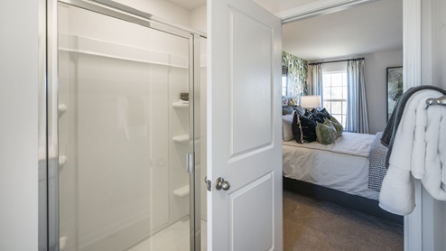 Main Bedroom attached bathroom shower with sealed door and entrance.