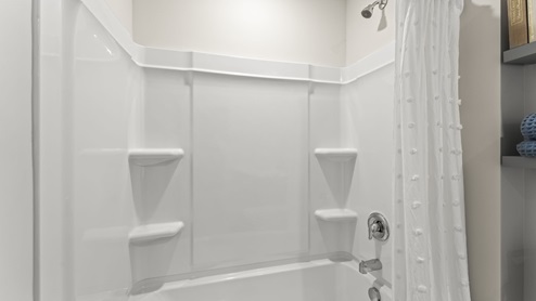 Bathroom with a step in shower.