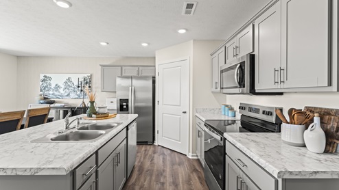 Kitchen with stainless steel appliances.