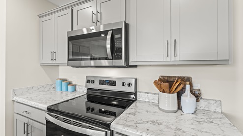Kitchen with gray cabinetry.