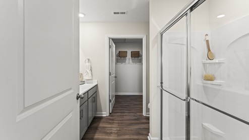 Bathroom with a glass door walk in shower.