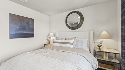 Bedroom with carpeted floors.