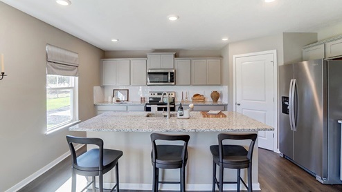 kitchen with built in island and corner pantry
