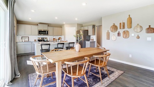 dining table with chairs and kitchen