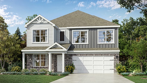 Front exterior of a Stamford home featuring grey siding, stone accents and a 2 car garage