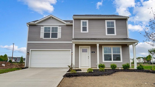 two story home with grey siding, covered front porch and two car garage