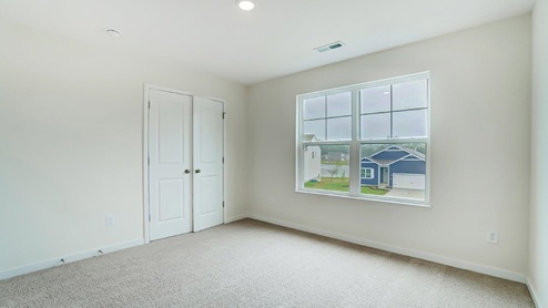 fourth bedroom with closet and double window