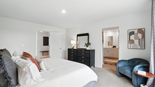 furnished primary bedroom with ensuite bath