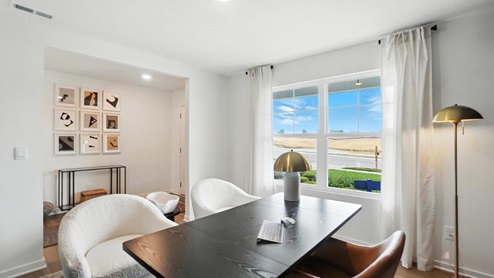 flex office space with desk, chairs and double window