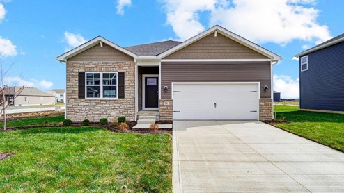 Single story home with brown siding, partial stone front, covered entry, two car garage_Aldridge