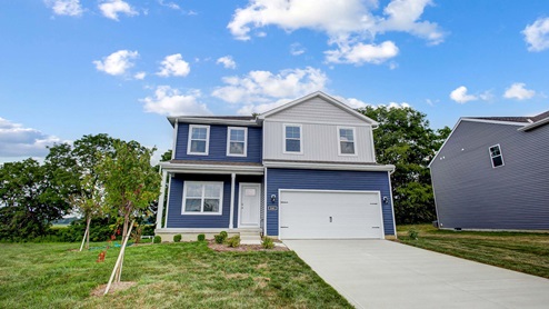 Exterior blue two story home with white cladding