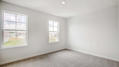 Interior bedroom with two windows