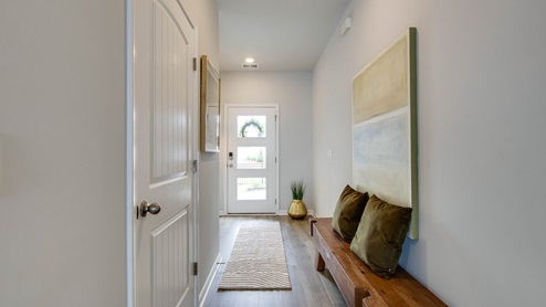 Entry to modern, open concept floorplan
