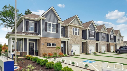 Two story new townhome building in river landing exterior view of these new construction homes