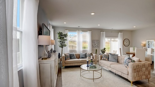 Open concept living and dining room in modern two story townhome.