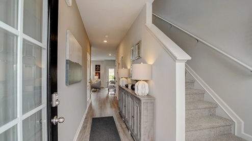 Pearson entry with stairs on the right and hallway straight ahead