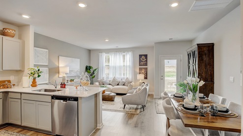 Open concept kitchen and dining room in new townhome.