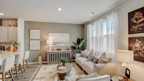 Living area in open-concept townhome connected to the kitchen