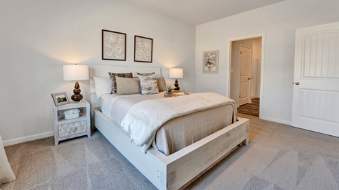 Primary bedroom comfortably fits a king size bed