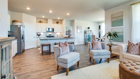bristol plan riverwood gardens community showing open-concept living with open view of the living room overlooking the kitchen and dinind area