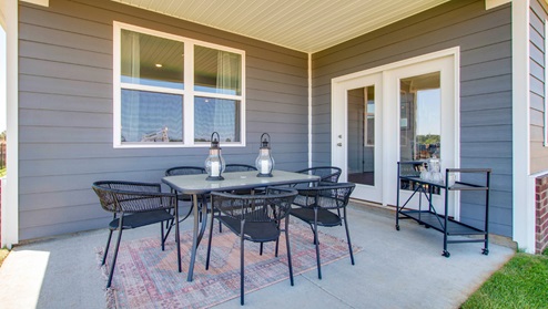 bristol plan covered patio at the rear of the home in riverwood gardens community