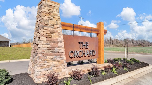 the orchard community entrance monument, welcoming you to your new home in millington, tennessee