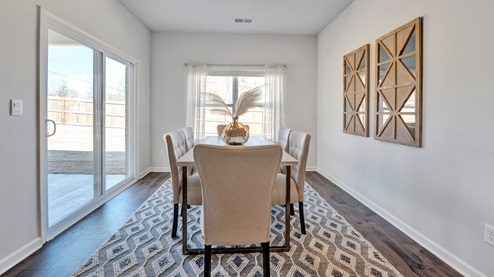 Dining area with close access out to covered patio