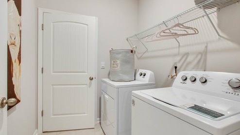 Laundry room with ventilated shelving