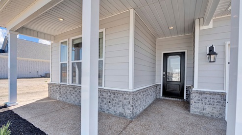 Front door covered porch entering into the Clifton