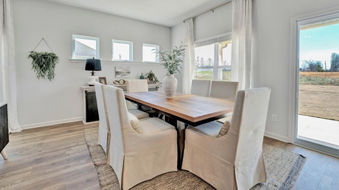 Dining area with picture window accents for natural light